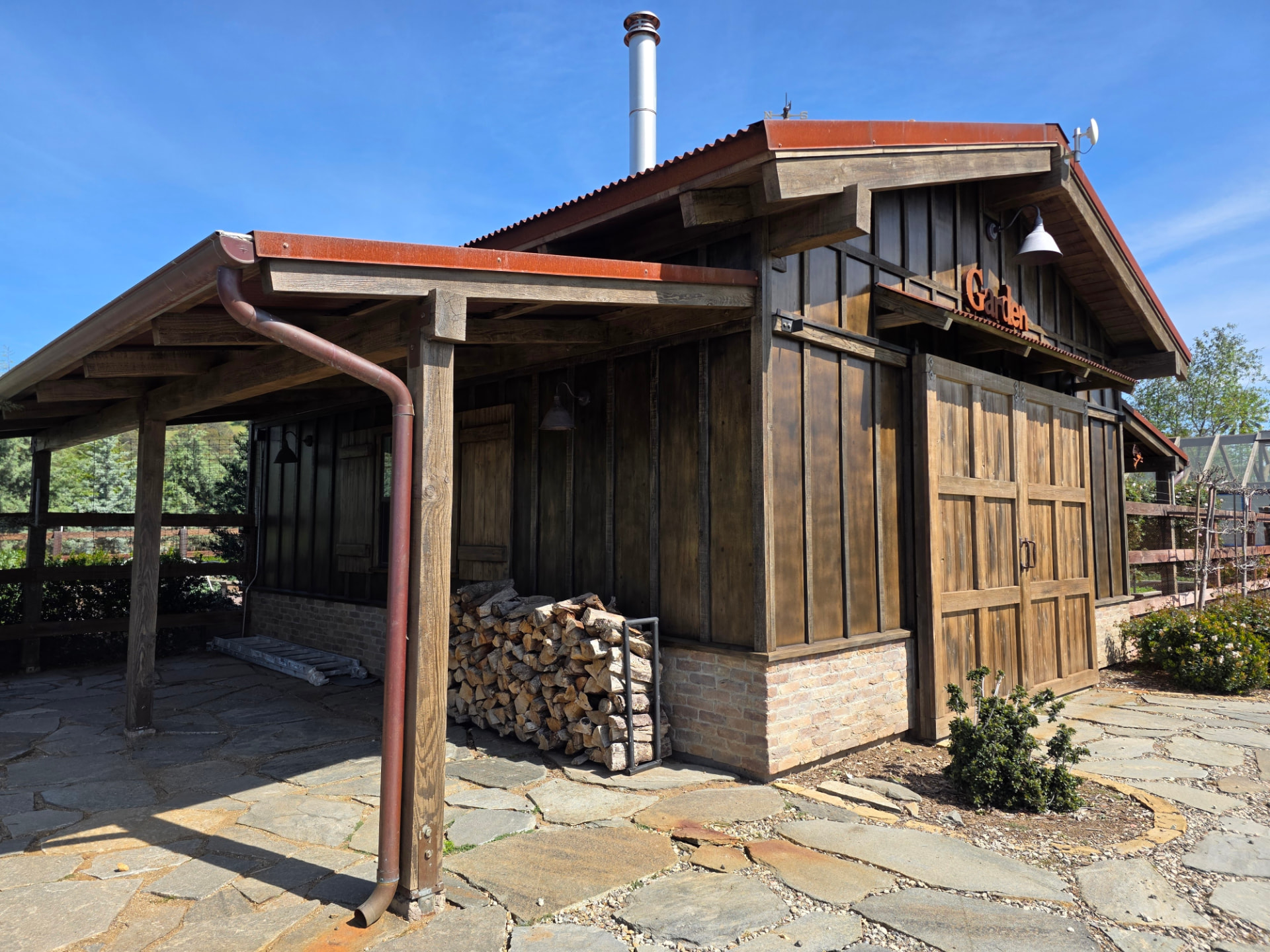 Exterior wood building with a freshly refinished, richly stained surface